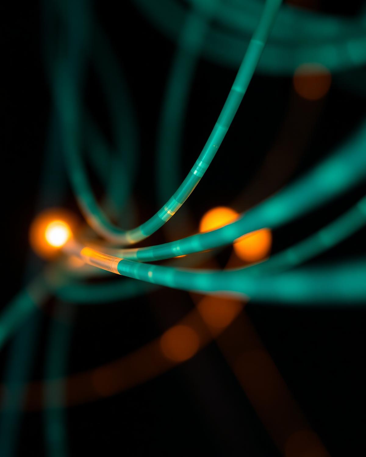 Illuminated fiber optic cables representing modern digital infrastructure